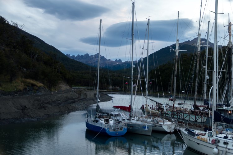 Boats in the harbour of Puerto Williams, the southernmost settlement in the world, with the Dientes de Navarino mountains behind. 