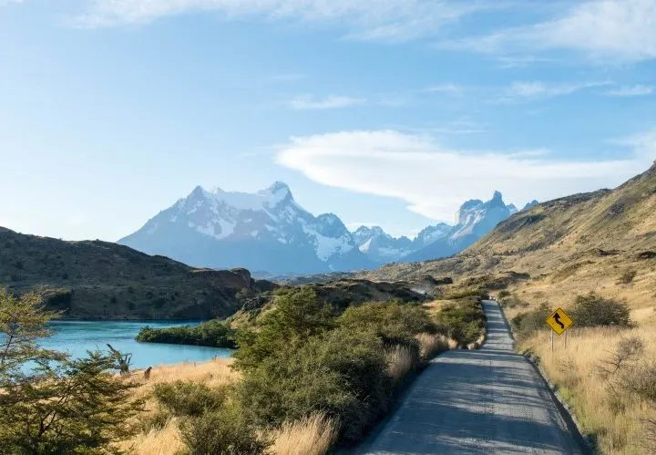 The paved road into Torres del Paine National Park from the south, facing the Los Cuernos mountins and a key destination to include in a Patagonia itinerary for one week or two weeks