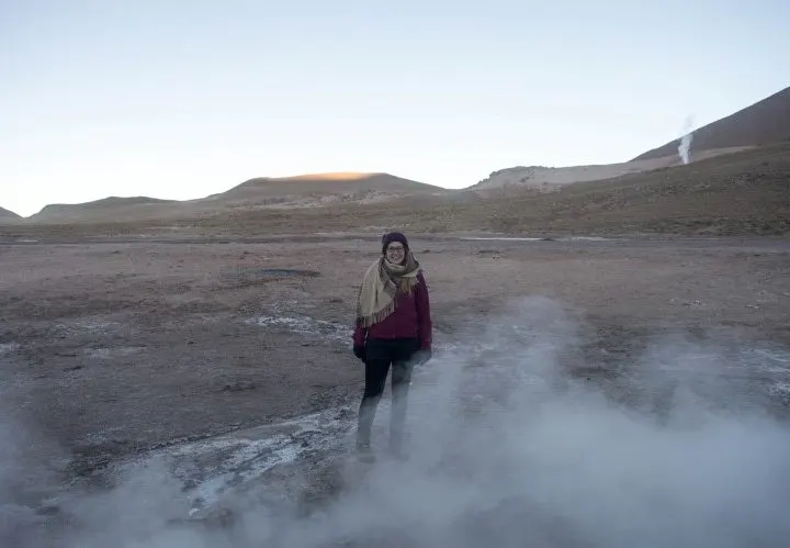 Standing in the steam at El Tatio Geysers near San Pedro de Atacama