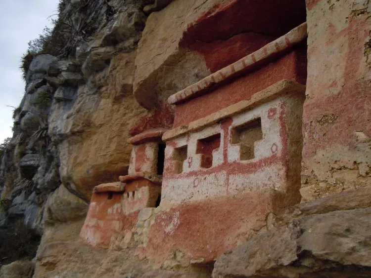 The painted mausoleums of Revash perched in the cliff above the valley near Chachapoyas Peru