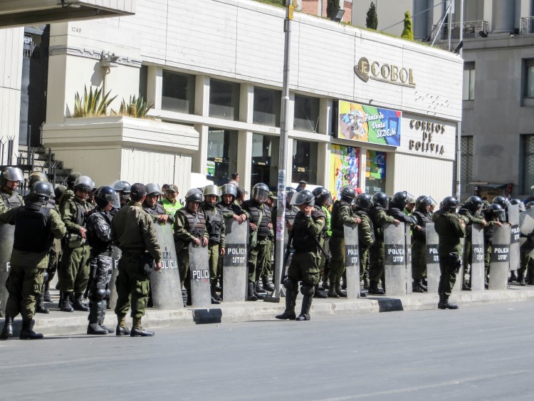 A protest in La Paz Bolivia. Stay safe in Bolivia by avoiding all protests or street demonstrations