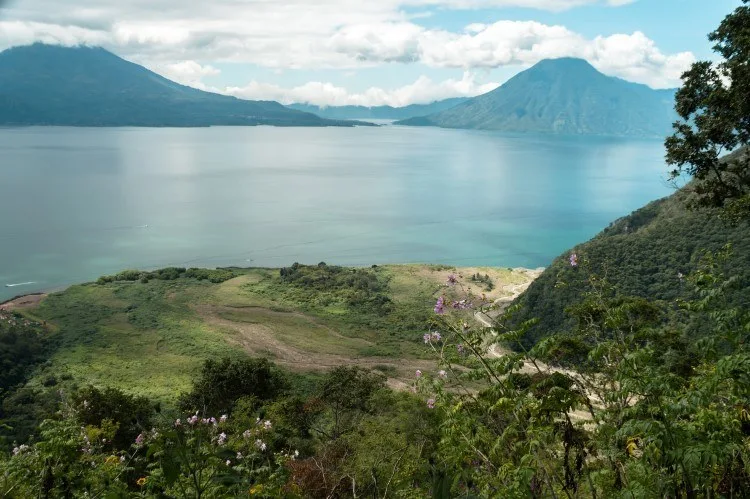 The crystalline waters of Lake Atitlan, top of what to do in Guatemala and bursting with sustainable tourism initiatives