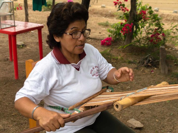 A weaver makes textiles using organic, wild cotton in the Bosque de Pomac in northern Peru, a responsible tourism destination in South America