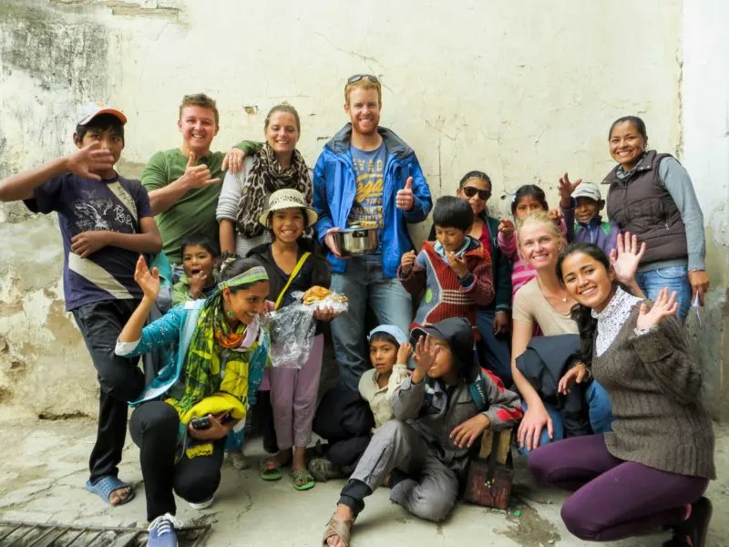 A group of volunteers and children in South America