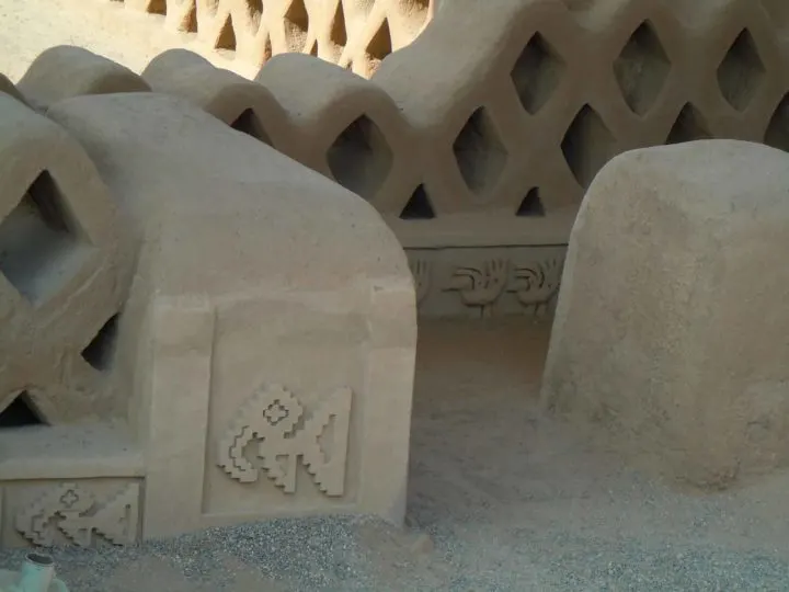 Relief carvings in the adobe on the walls of the ancient city of Chan Chan near Huanchaco and Trujillo, Peru