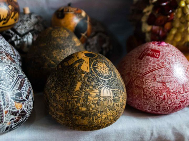 A carved gourd depicting scenes from Peruvian history in Cochas Grande near Huancayo, an unmissable place to visit in Peru