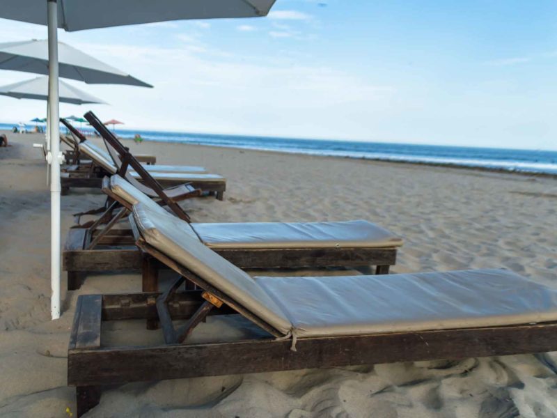 Sun loungers on the main beach in Mancora one of the most popular places to visit in Peru for backpackers and surfers
