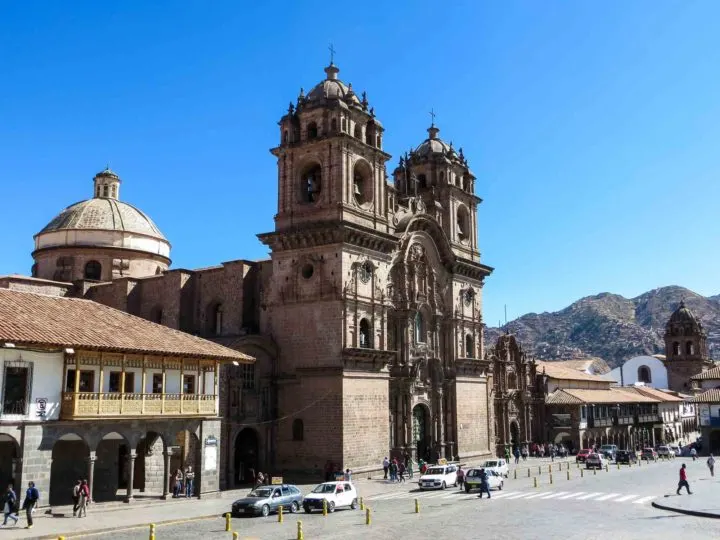The Plaza de Armas in the historic core of Cusco and the Iglesia De La Compañia De Jesús, a church built by the Spanish and a central place to go on a trip to Peru