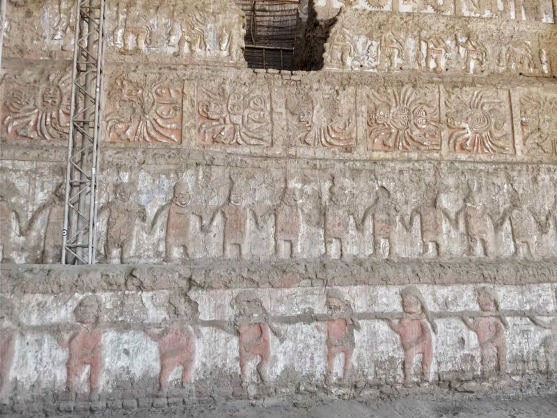 The frieze murals on the side of the Huaca de la Luna near Trujillo and a top destination for those with an interest in history and archeology in Peru