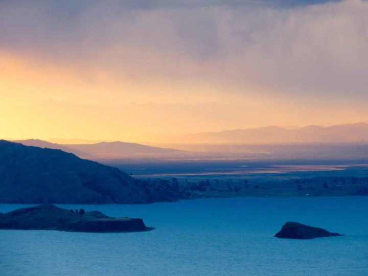 Sunset from Isla Amantani across Lago Titicaca, an unmissable place to visit in Peru