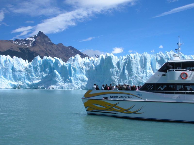 A boat approaches the snout of the Perito Moreno Glacier in Parque Nacional Los Glaciares near El Calafate Argentina