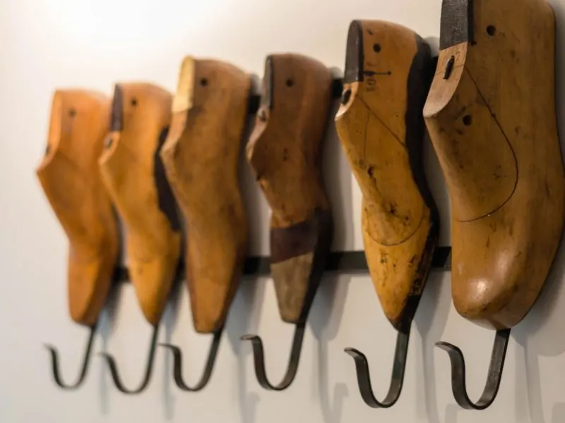 Wooden shoe moulds act as a coat hanger on the walls of the bedrooms in Selina, a great place to stay in Lima, Peru