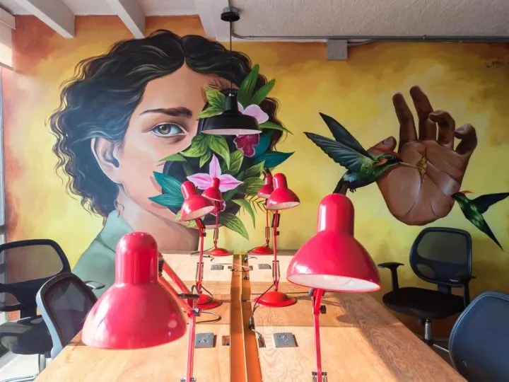 A mural painted above the desks in the Selina Lima coworking space.
