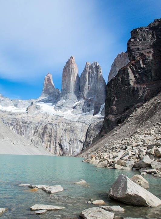 Jagged mountain peaks overlooking a glacial lake. Best Places to Hike in South America.