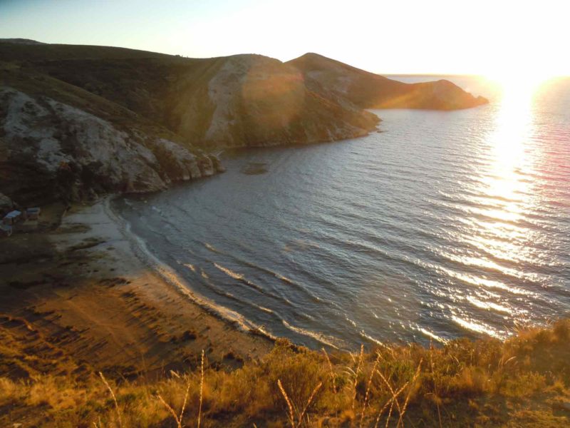 The Sunset over Mountains and Beaches on the Isla del Sol on this South America Backpacking Route.