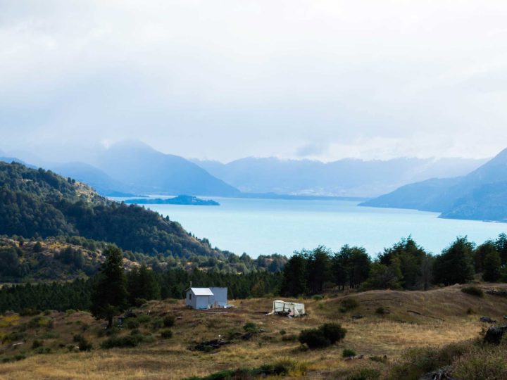 A wooden hut in front of Lago General Carrera along Patagonia's Carretera Austral