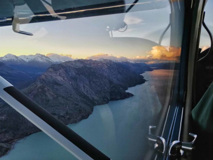 Inside of a light aircraft with views out of the window at the mountains surrounding Villa O'Higgins along the Carretera Austral