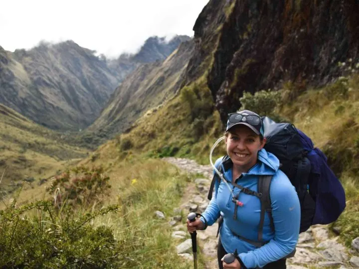 A hiker stands at the top of the Dead Woman's Pass on the inca trail