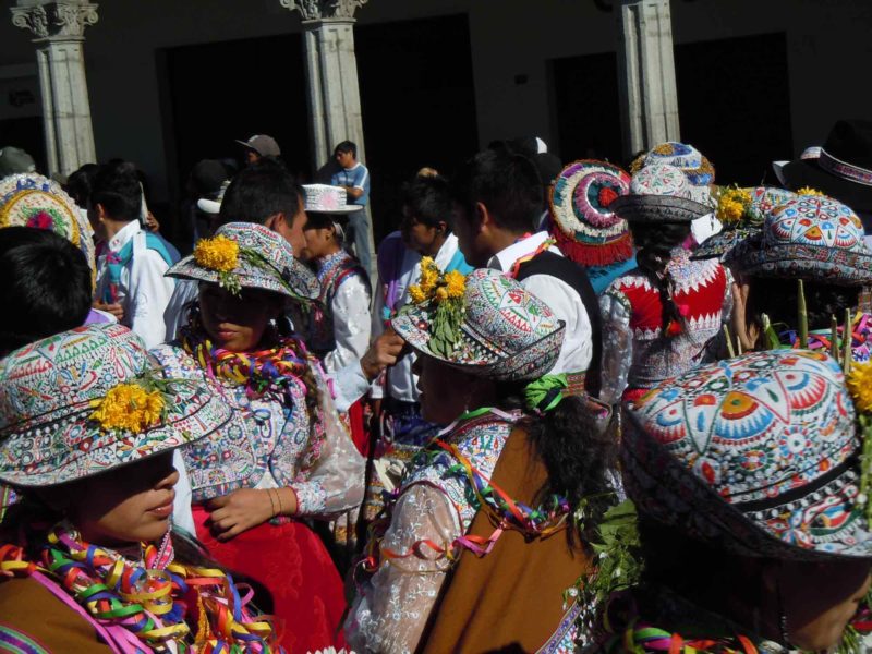 The brightly decorated hats of Arequipa Traditional Dress on this South America Backpacking Route 