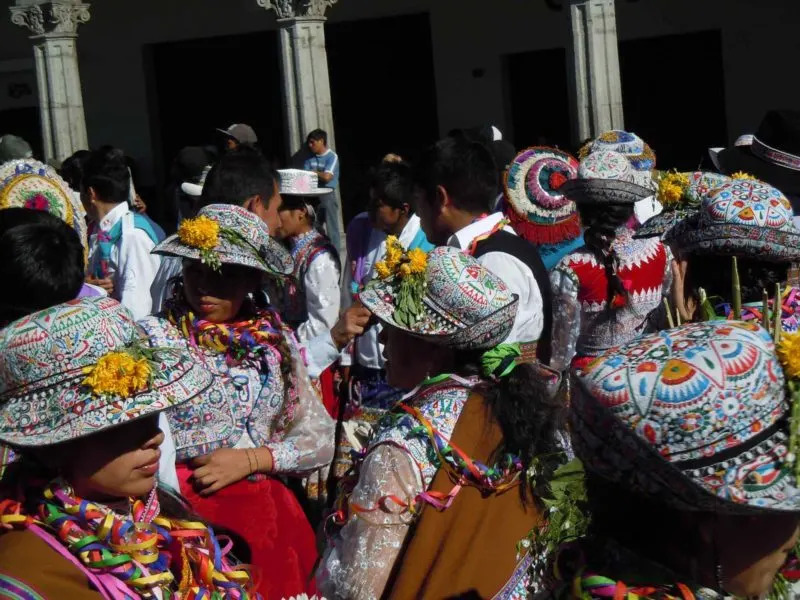 The brightly decorated hats of Arequipa Traditional Dress on this South America Backpacking Route 