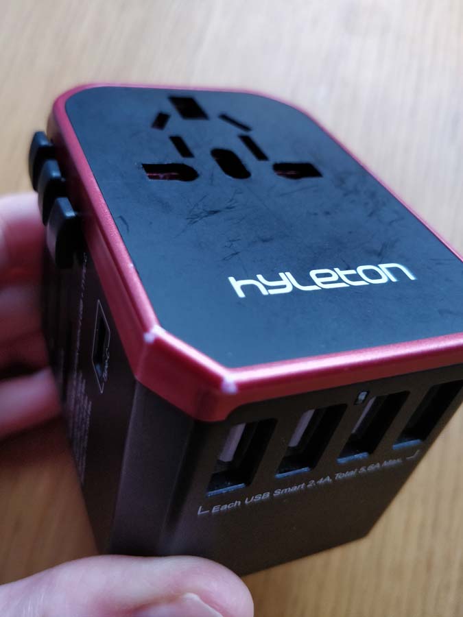 Close up of a hyleton travel adaptor plug, one of the best gifts for travel lovers
