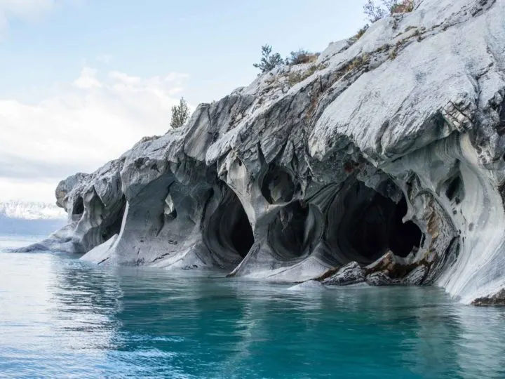 The smoothly water-carved Marble Caves can be seen from the shore when driving through Patagonia