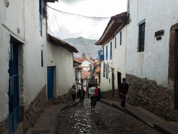 The cobbled streets of Santa Ana, one of the main neighbourhoods where to stay in Cusco, Peru