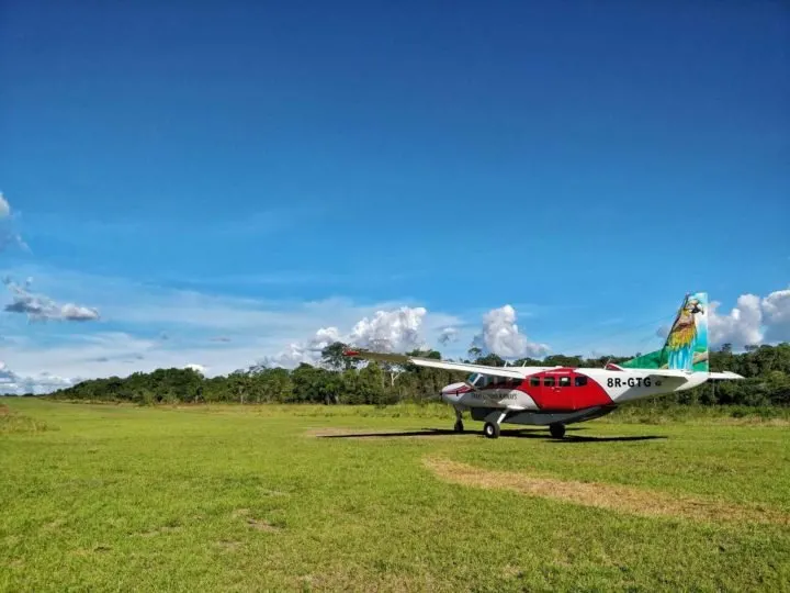 A light aircraft on a dirt runway in Guyana, South America