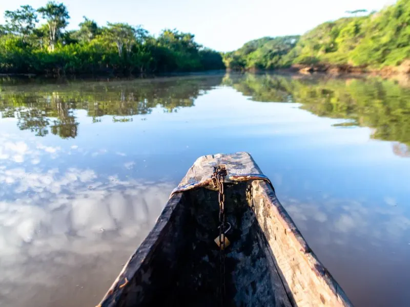 Overlooking a lake from the front of a dugout canoe in Guyana.