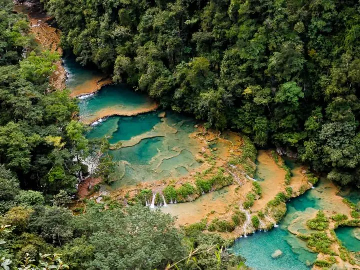 Semuc Champey, a series of tiered pools of water deep into the Guatemalan jungle and a must-visit destination on a Guatemala itinerary