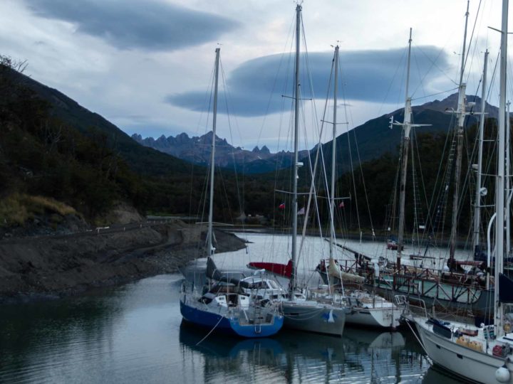 The Dientes de Navarino mountains behind yachts in the harbour in Puerto Williams, Chilean Patagonia