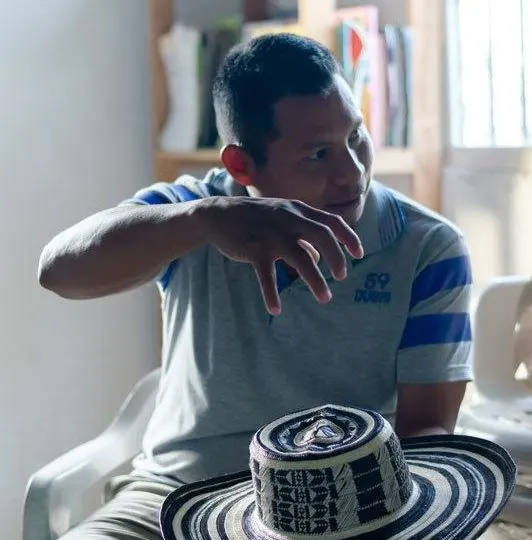 Wilfrido Perez Luca holds a sombrero vueltiao, a traditional Zenu and Colombian hat made from cana flecha