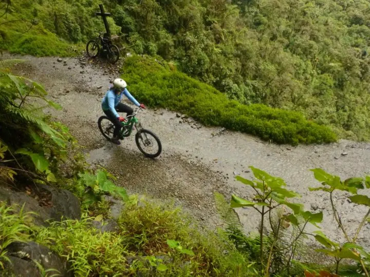 A mountain biker riding down Death Road in Bolivia