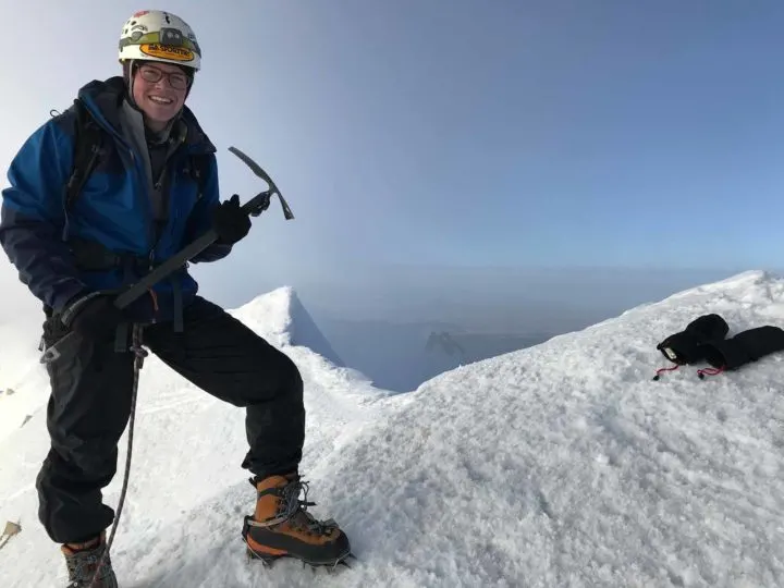 A climber with an ice axe on a stretch of ice on Huayna Potosi, Bolivia