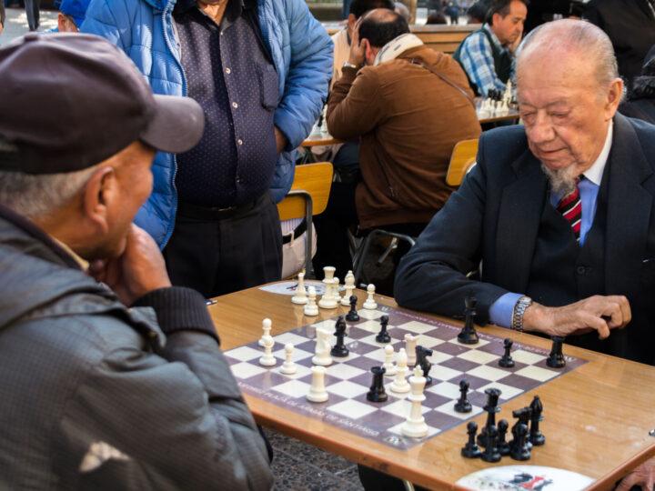 Two men play chess in the Plaza de Armas in Santiago, Chile