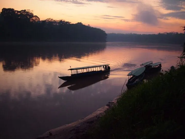 Sunrise over a river in the Amazon rainforest in Peru