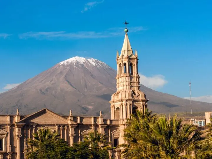 Arequipa's Cathedral rises out of the city with the Misti volcano behind