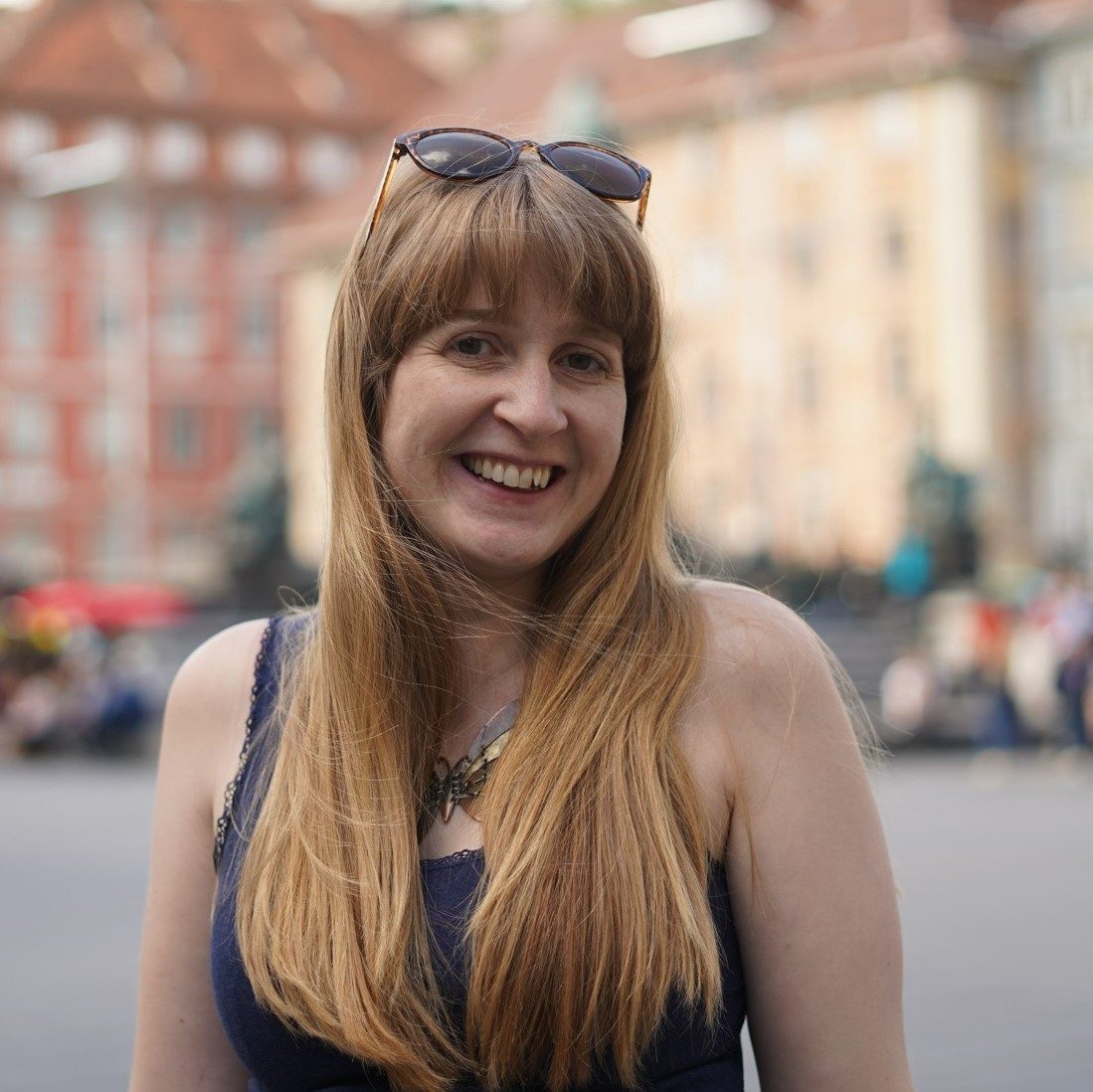 Steph Dyson, a freelance travel journalist, standing in a square in Graz, Austria