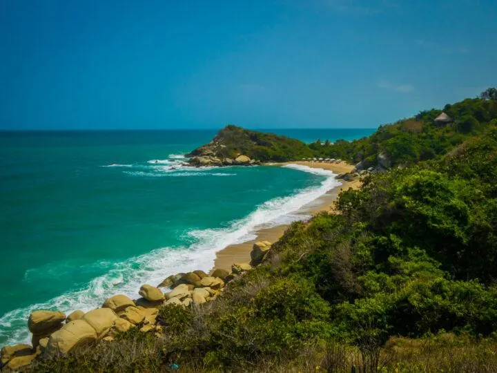 A white-sand beach and tropical coastline in Tayrona National Park in Colombia