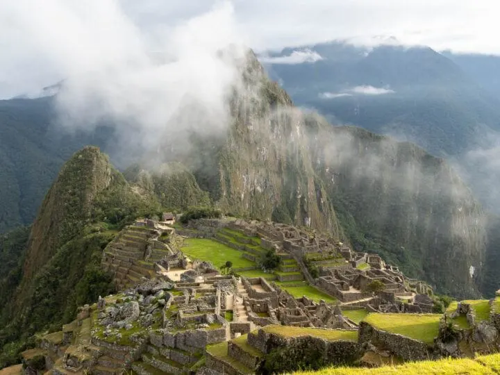 Machu Picchu as seen at dawn as mist clings to Huayna Picchu
