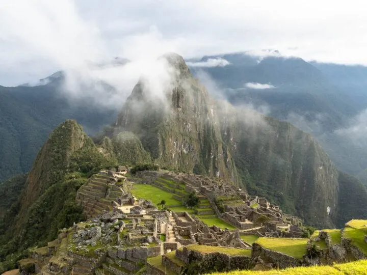 Machu Picchu as seen at dawn as mist clings to Huayna Picchu
