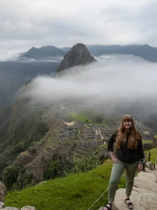 Steph Dyson posing in front of Machu Picchu, Peru, after hiking the Salkantay trek