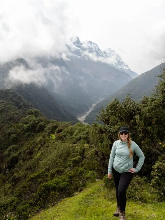 Posing in front of mountains on the Salkantay trek to Machu Picchu