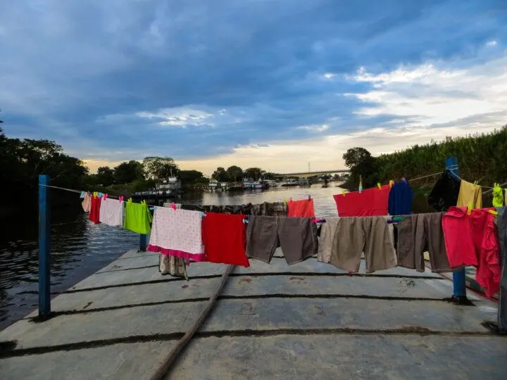 Clothes hang to dry on the top of a cargo boat on the River Manmore in the Bolivian Amazon