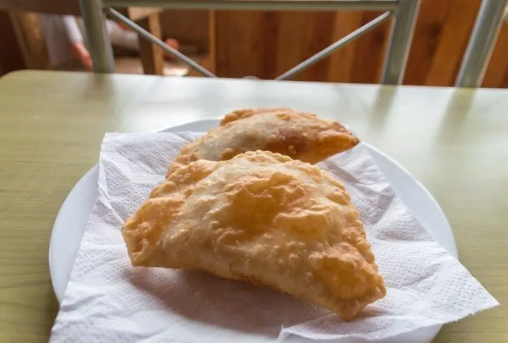 Empanada de Jaiba is made with a savory pastry dough filled with juicy crab meat and boiled eggs.