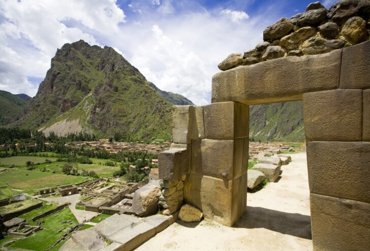 Ollantaytambo - a 15th-century Inca village with terraced hillsides and towering stone temples that reach up to the sky, located in Peru's Sacred Valley. 