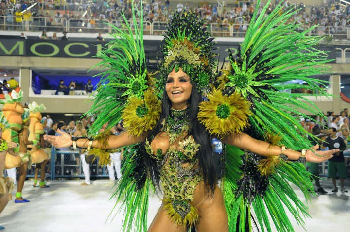A woman dressed in a green outfit at Rio de Janeiro's carnaval in Brazil, one of the best countries to visit in South America.