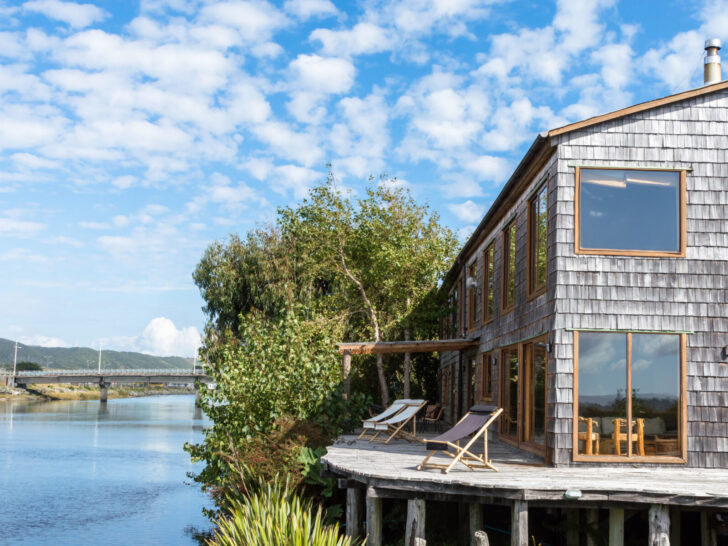 The wooden shingled Cucao Palafito that sits on stilts above a river in Chiloe