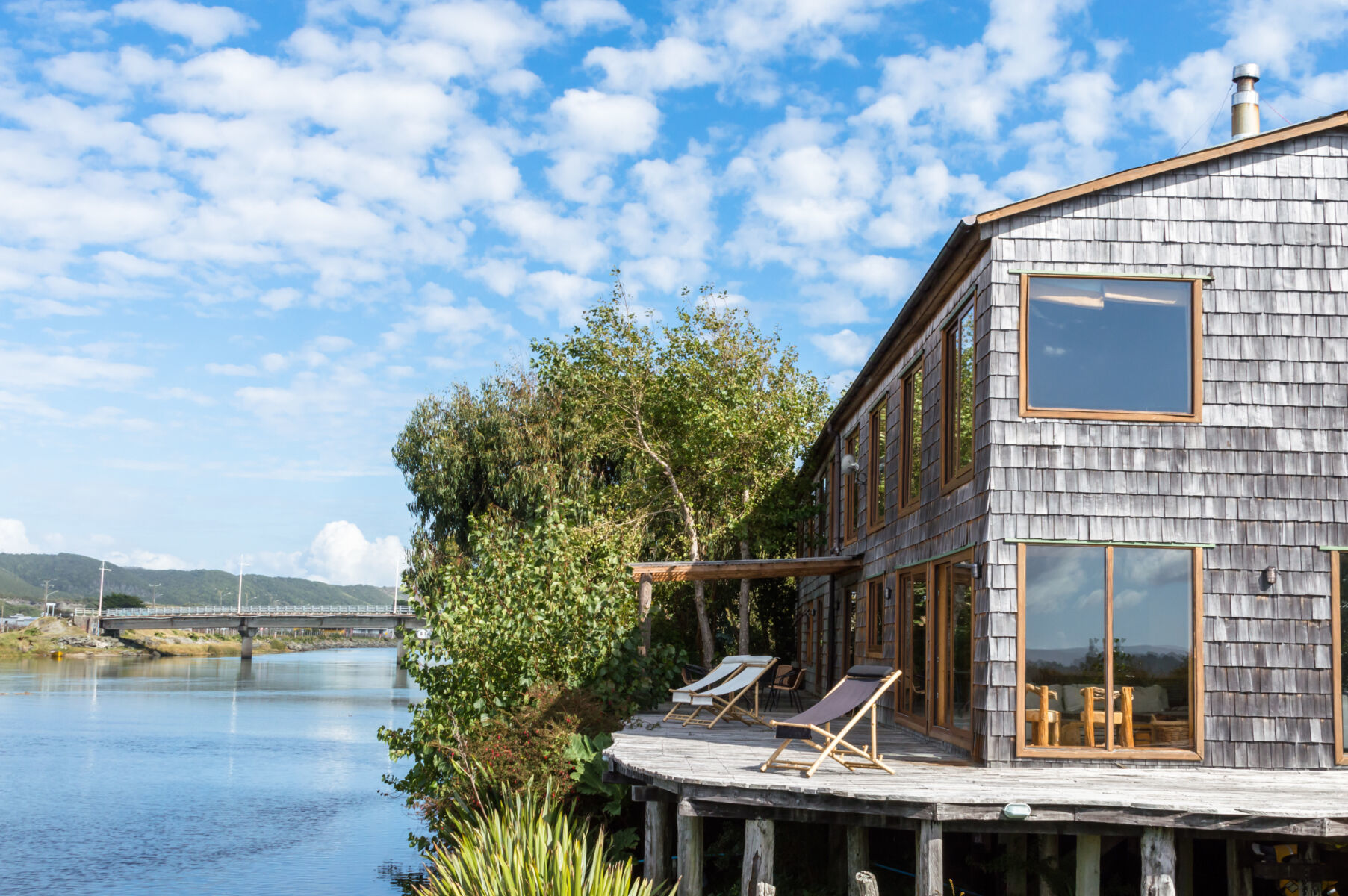 The wooden shingled Cucao Palafito that sits on stilts above a river in Chiloe
