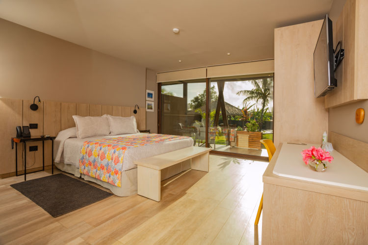 Photo of one the rooms at Ohana Hotel with a king sized bed